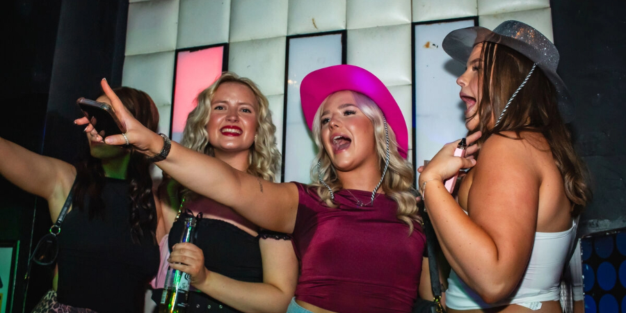 People on the stage at Retro Bars