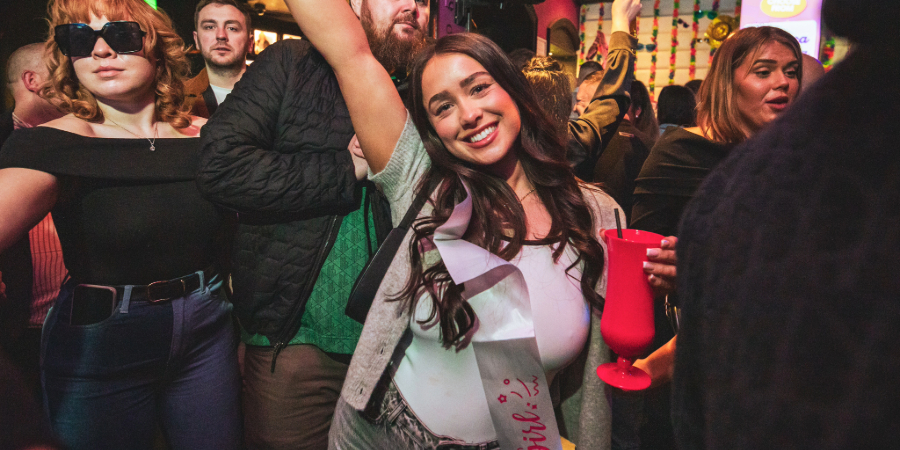 Lady with cocktail in hand at Retro Bars