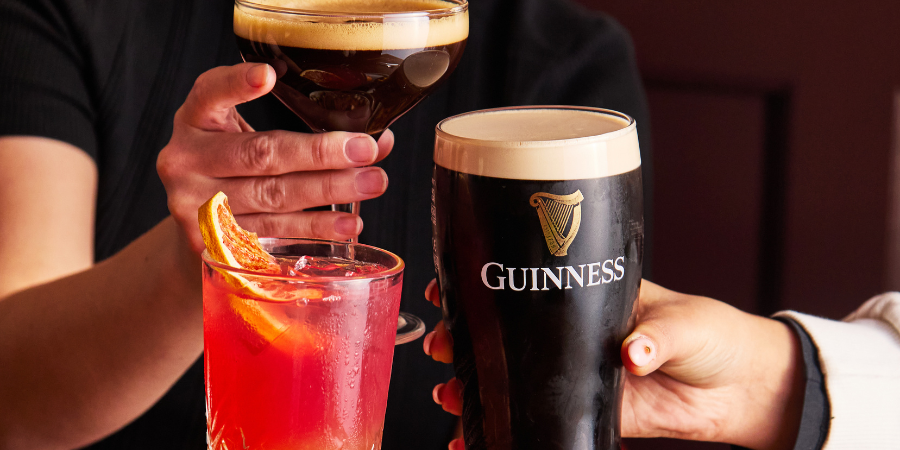 3 people cheersing drinks