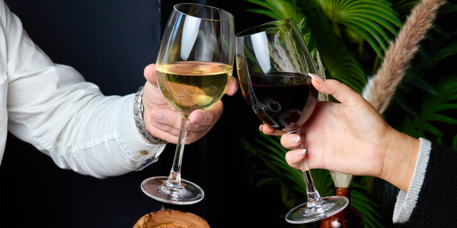 Glass of red and glass of white wine at The Chapter Collection