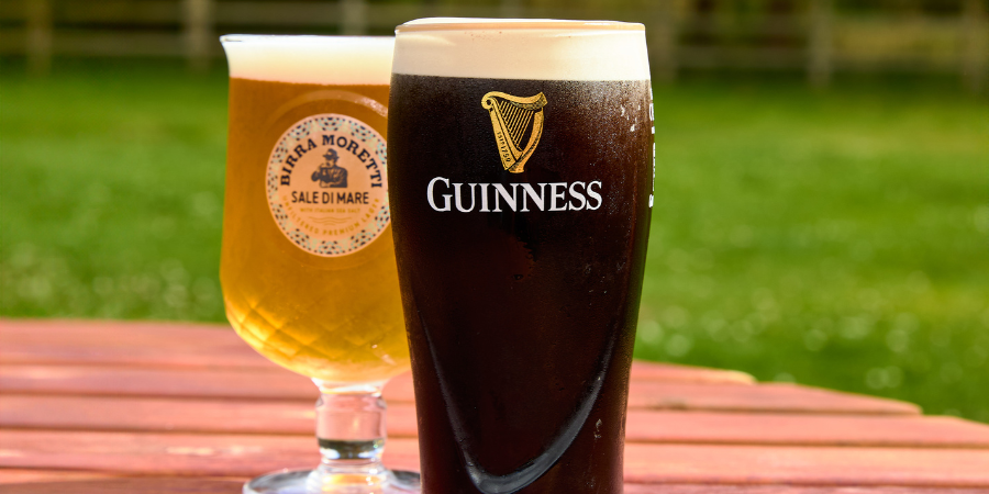 Guinness and pint of lager on a beer garden table