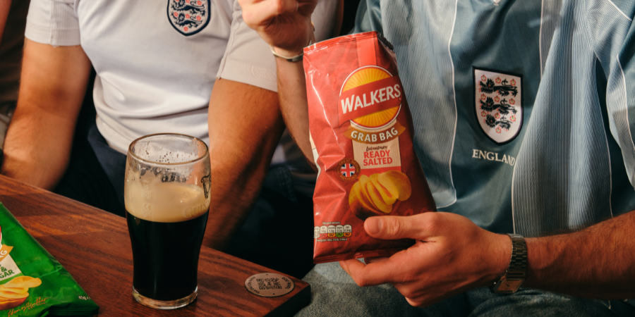 Bag of Walkers crisps and pint of Guinness