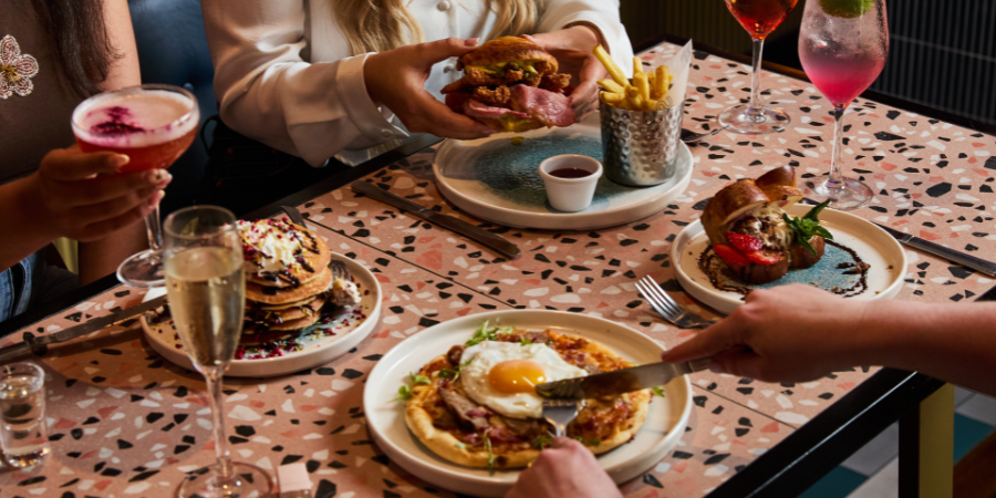 Girls toasting to their bottomless brunch in Cardiff