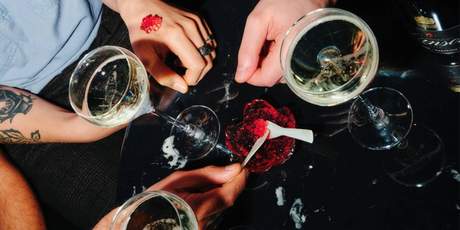 3 people enjoying a bellini bump cocktail