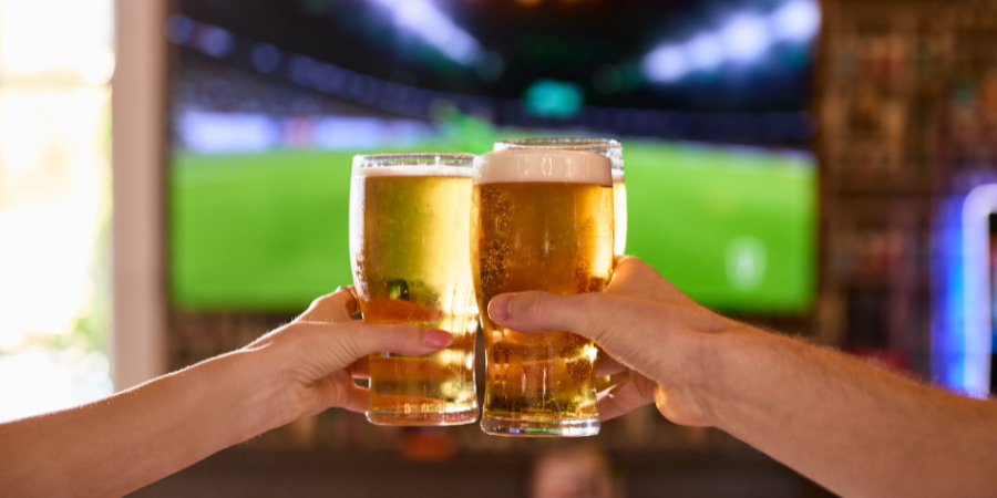 People holding pints People holding pints