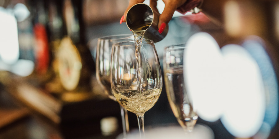 Glasses of wine being poured