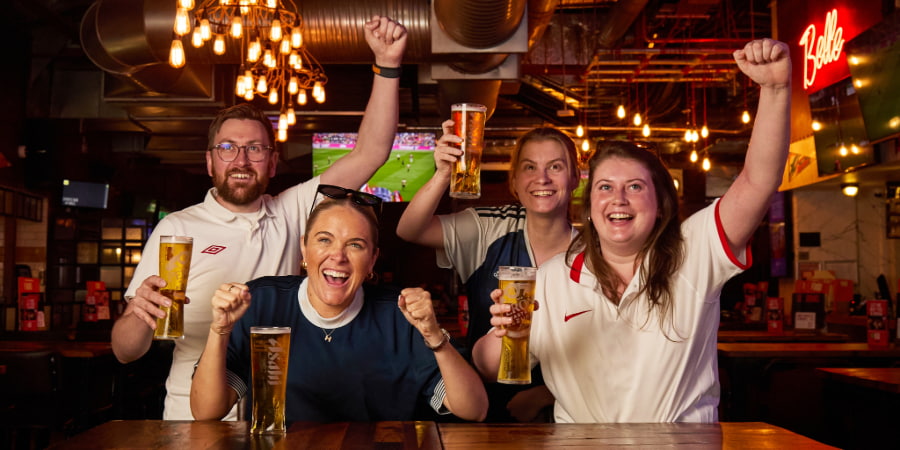 Fans celebrating watching their team at Felson's Birmingham