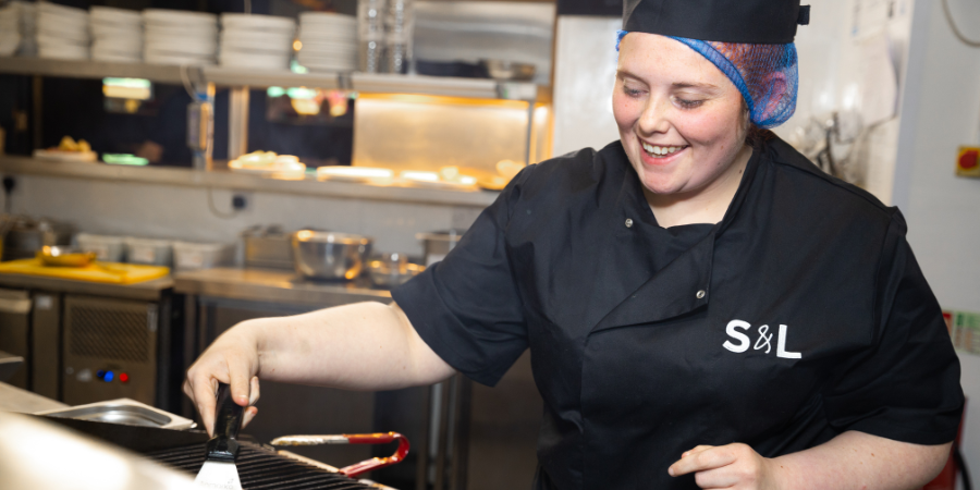 Kitchen Manager plating up a dish in a Slug & Lettuce kitchen