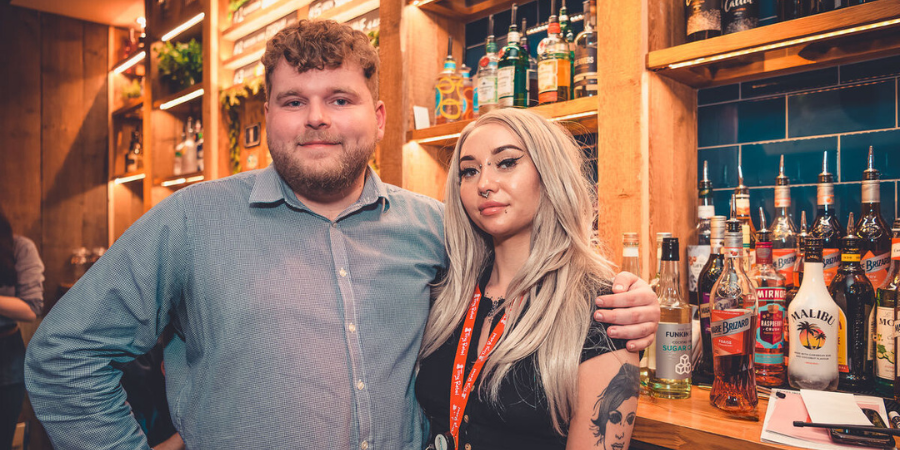 Two Team Leaders smiling at the camera