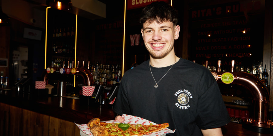 Team Members pouring spirit and juice into cocktail shaker
