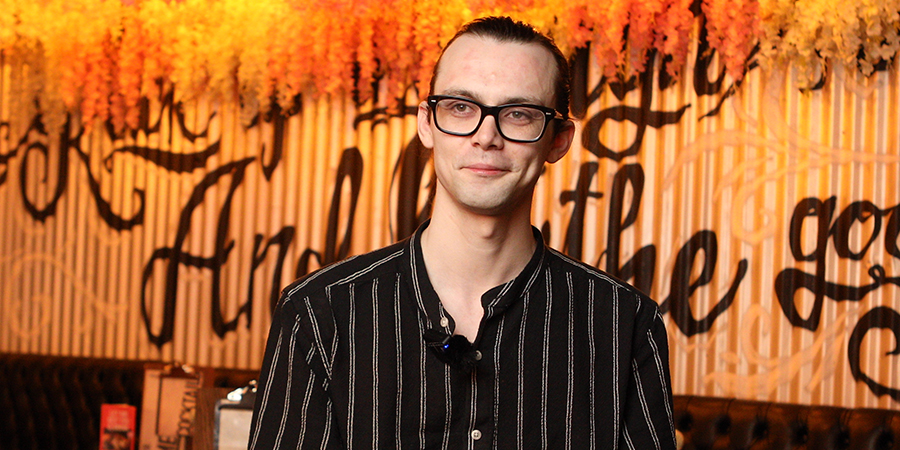 General Manager smiling at camera.