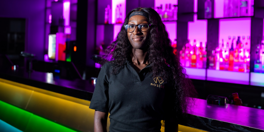 Female employee of Rosies smiling towards the camera.