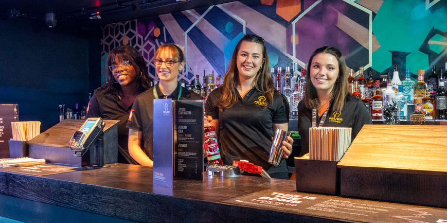 Team Members behind the bar at our Fever nightclub.