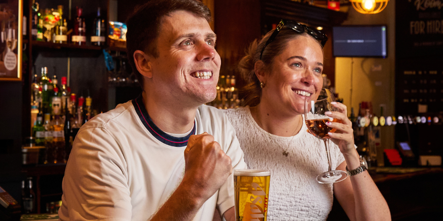 2 people watching live sport