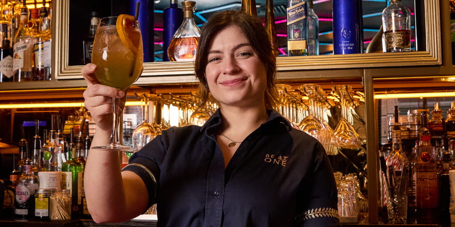 Best in Glass Winner, Lena posing with their cocktail.