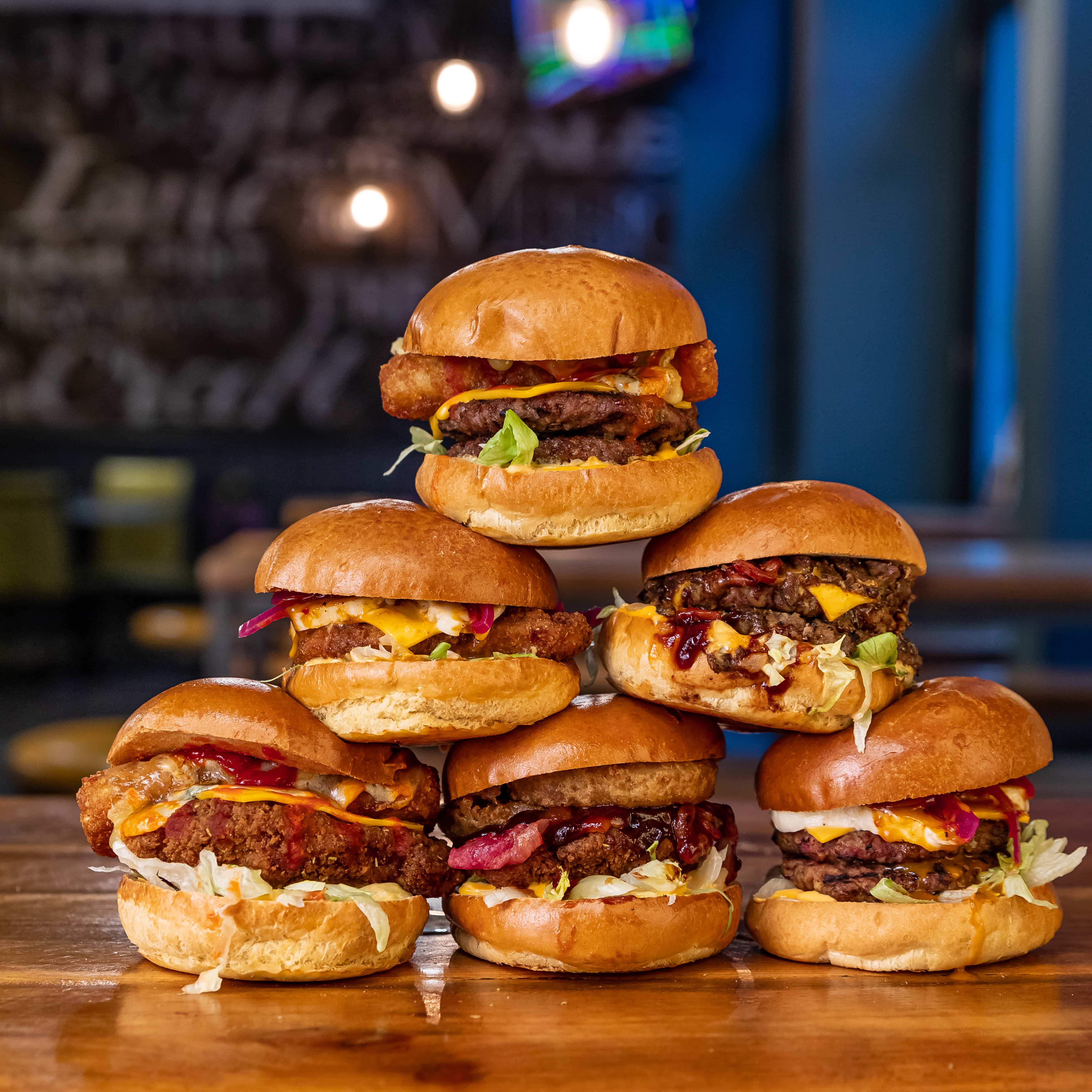 Stack of six tasty burgers available in the 2-4-1 deal