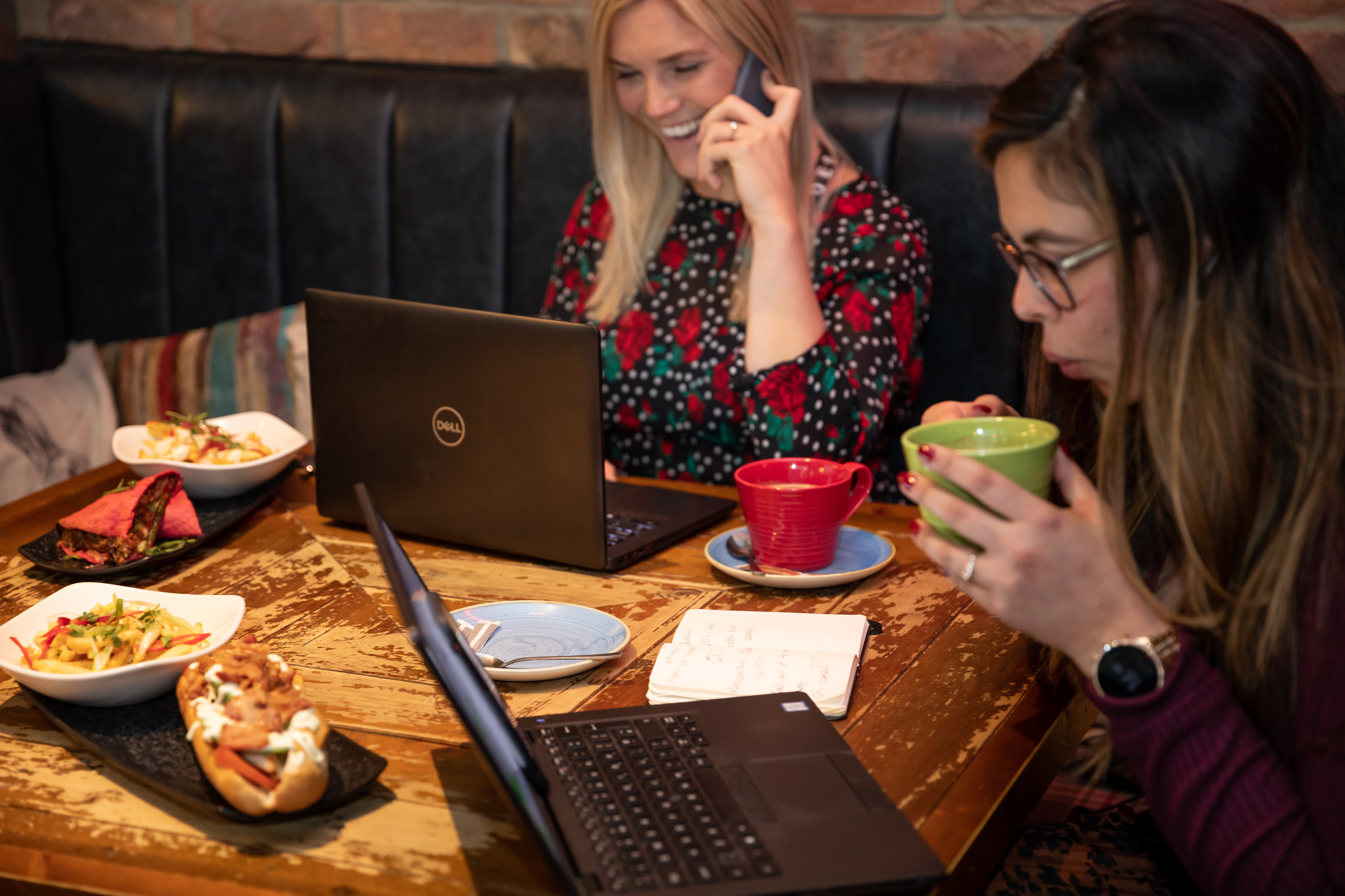 Lady working from the pub 