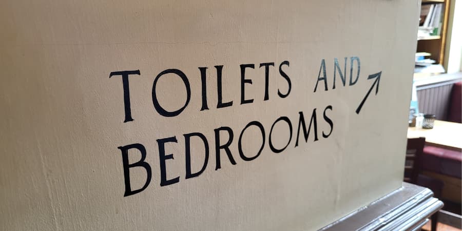 Toilets and bedrooms sign