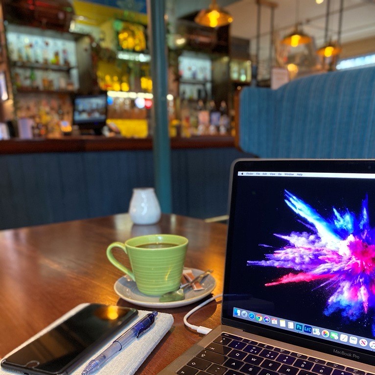 Working from a safe pub with laptop and coffee