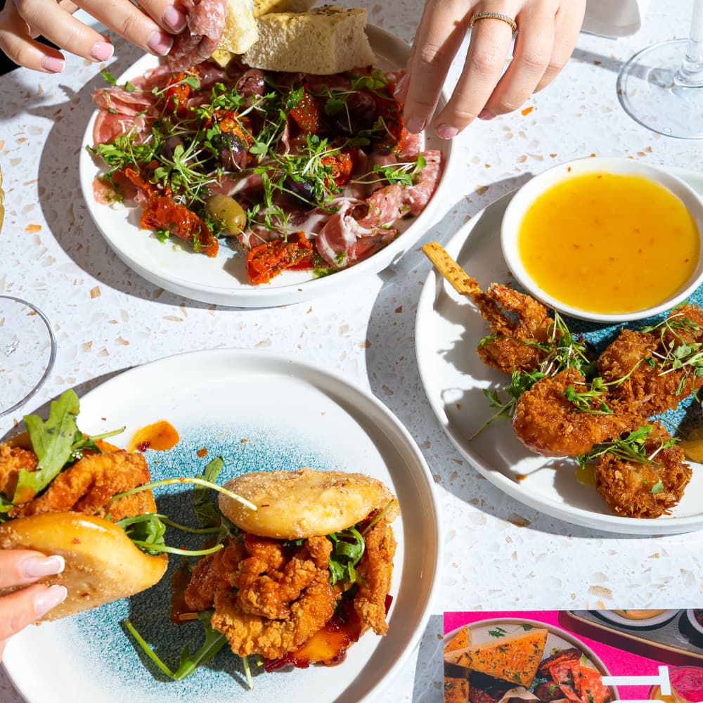 Crispy chicken bao buns, antipasti and crispy king prawn skewers