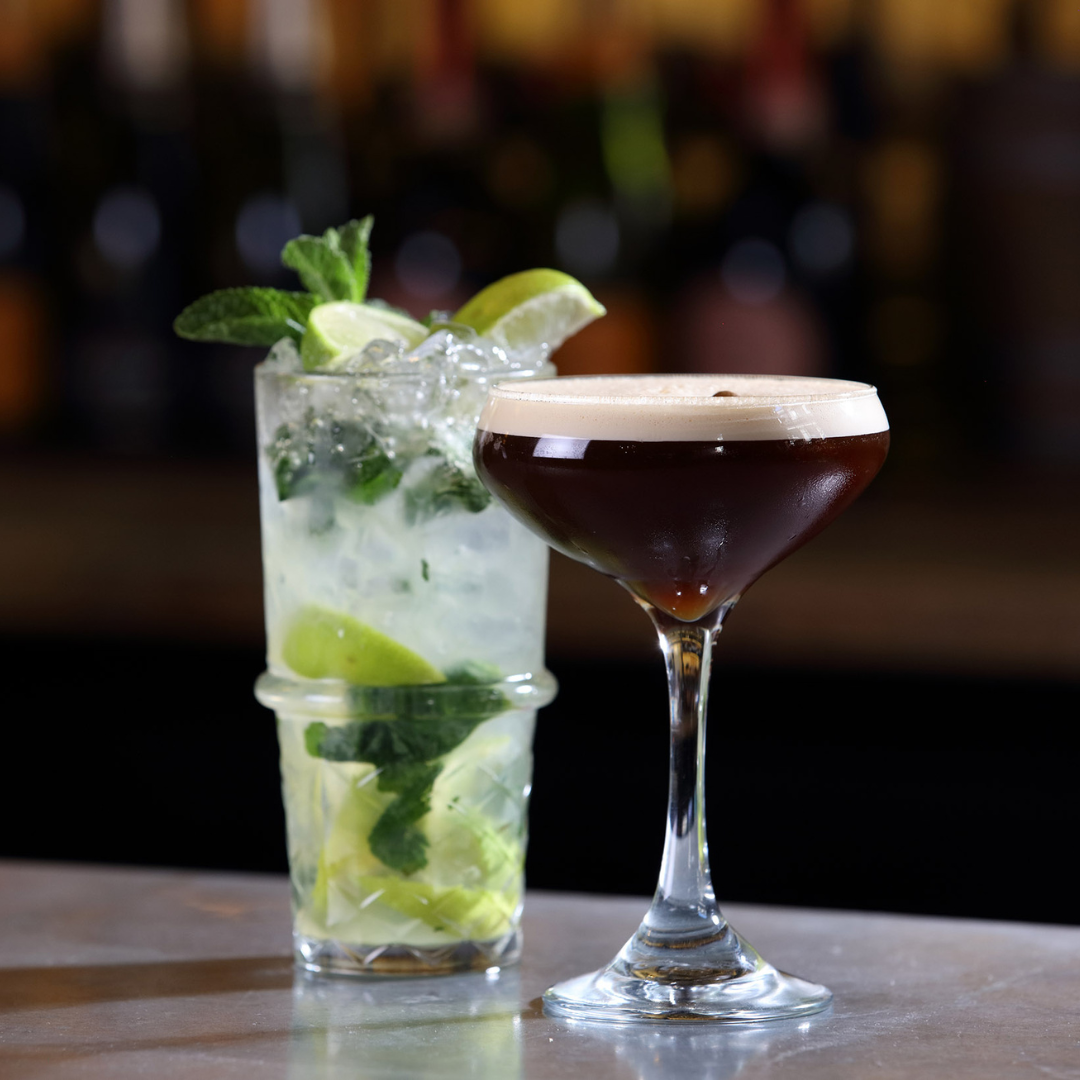 Espresso Martini and Mojito on a bar