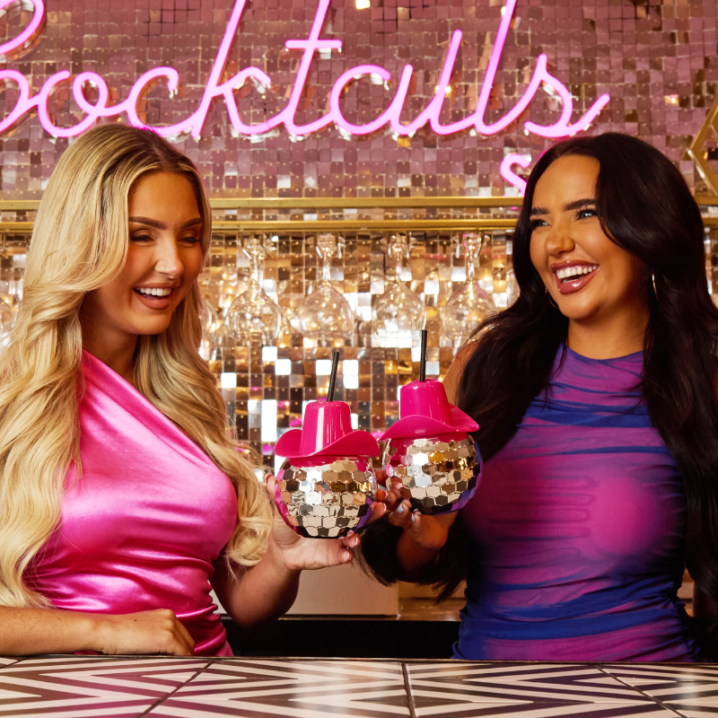 Girls toasting a Swiftie Cocktail