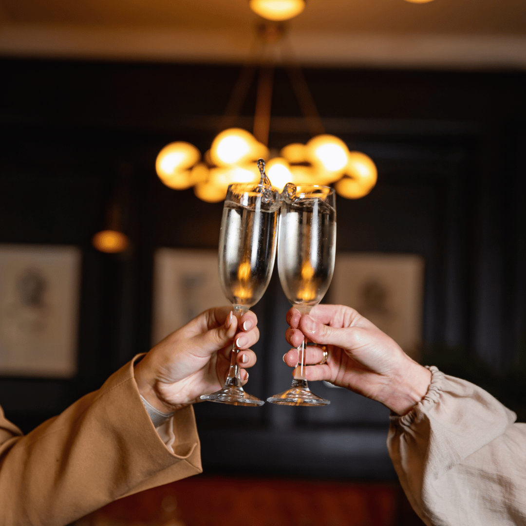 Two women toasting Silver Reign Brut