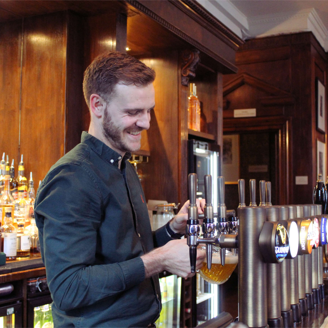 General Manager pouring a pint