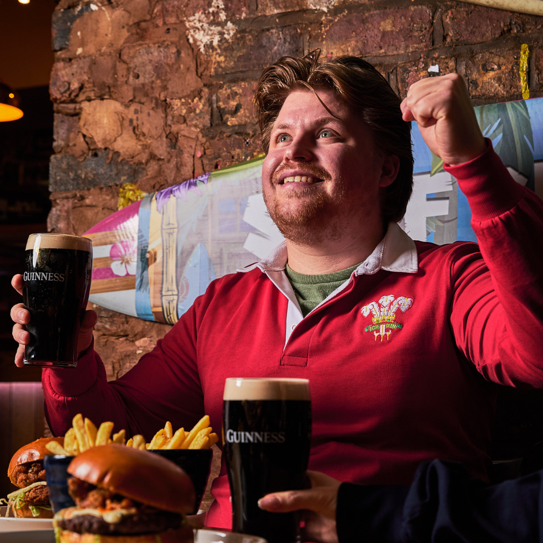 Watching rugby with a pint of Guinness