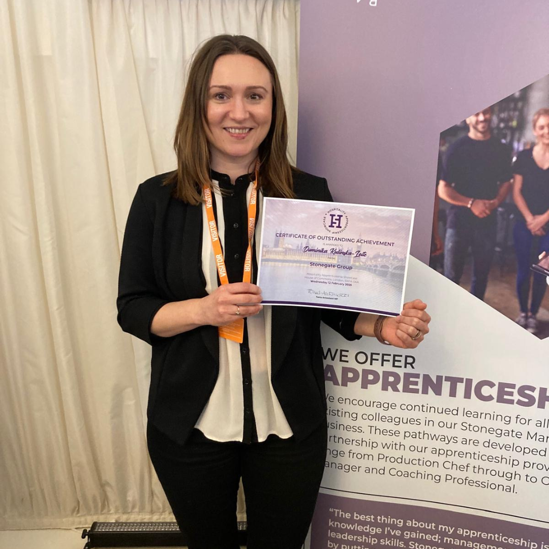 Image of Dominika with a certificate at the House of Commons.