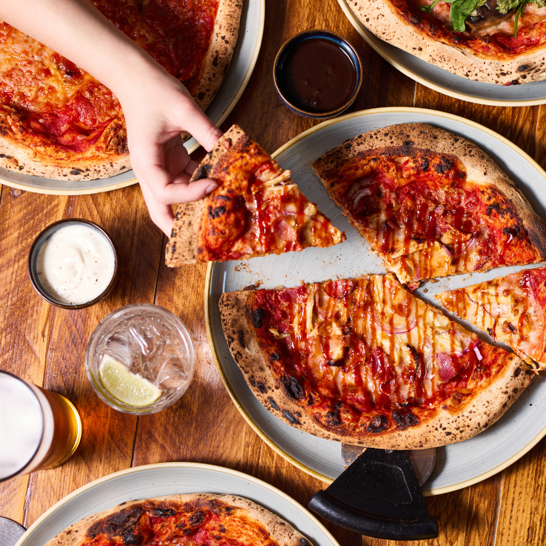 pizza on table with drinks