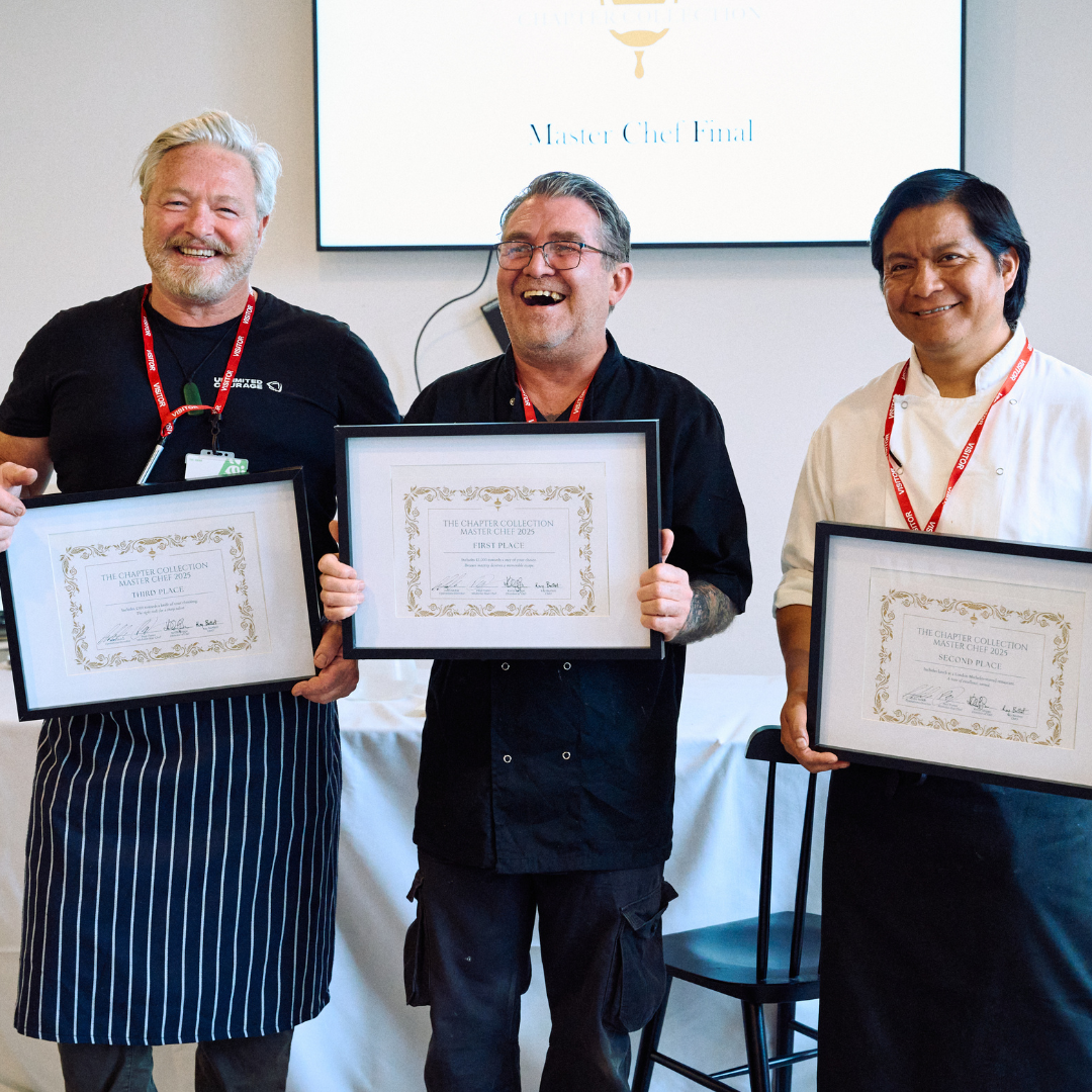 Image of Chefs Keith, Edison and David with their framed certificates smiling away from camera.
