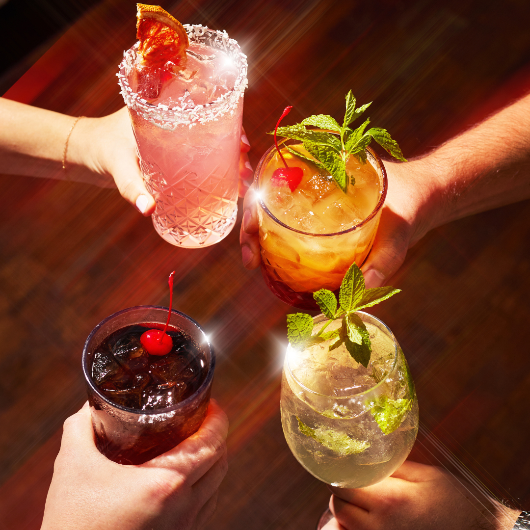4 people cheersing cocktails 4 people cheersing cocktails