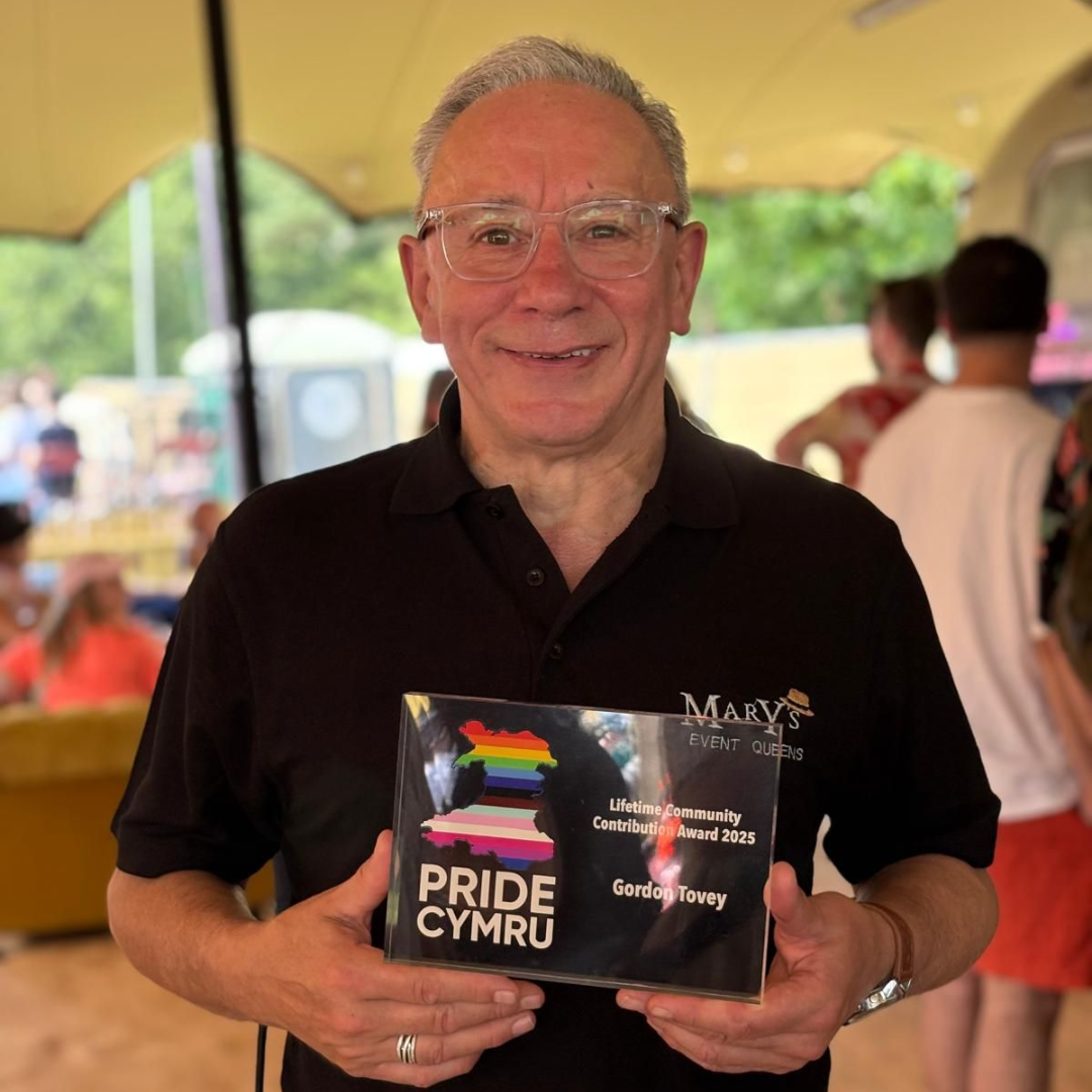 Gordon with his award from Pride Cymru