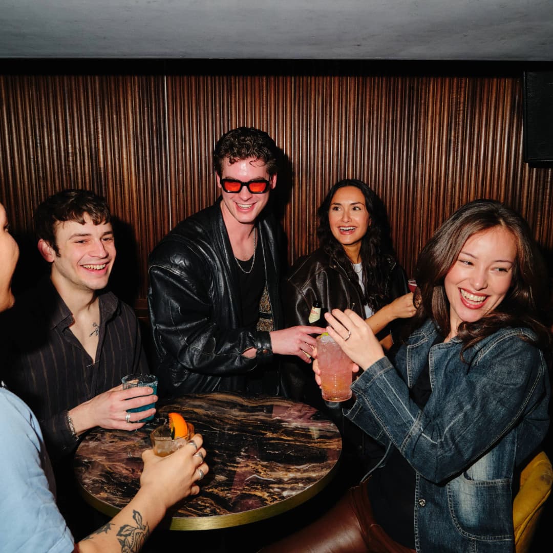 People enjoying cocktails at Be At One Liverpool