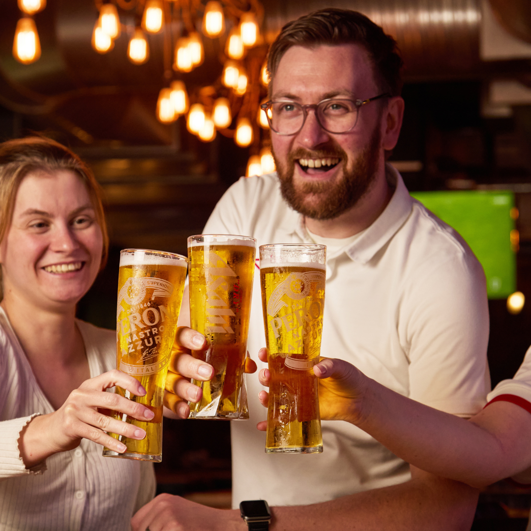 3 people cheersing drinks