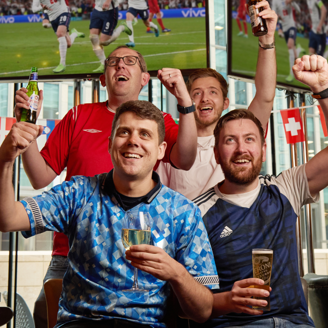 4 people watching England in the world cup