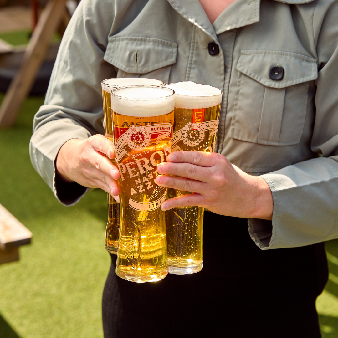 3 pints of peroni in a beer garden