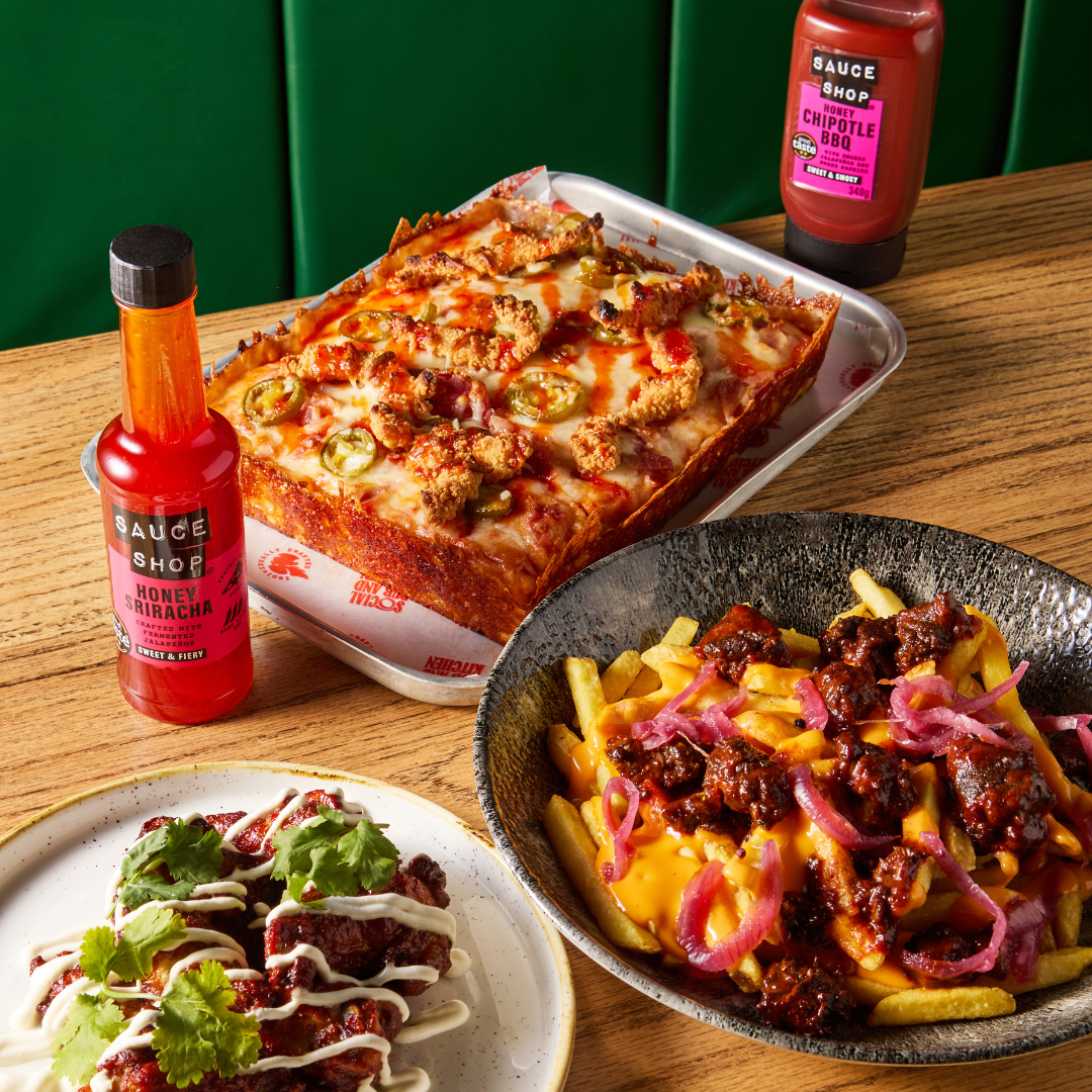 Pizza, Wings and Loaded Fries on table