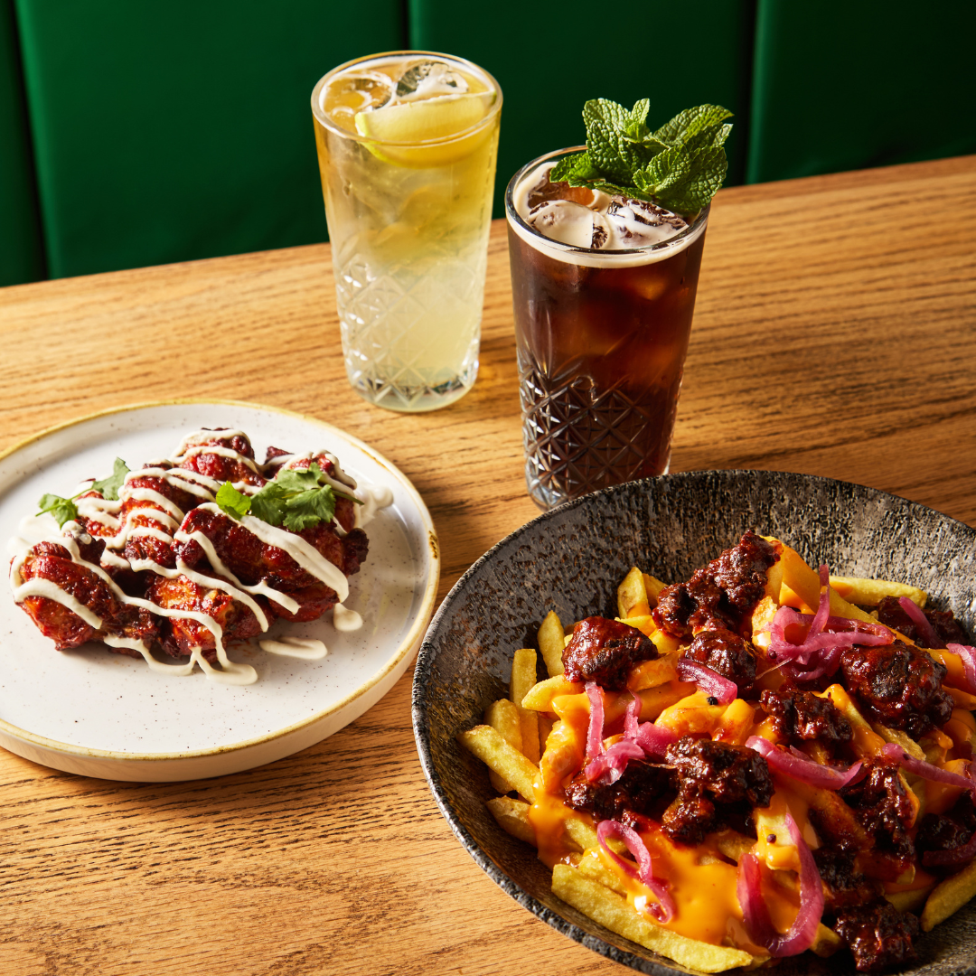 Wings and Loaded Fries on table