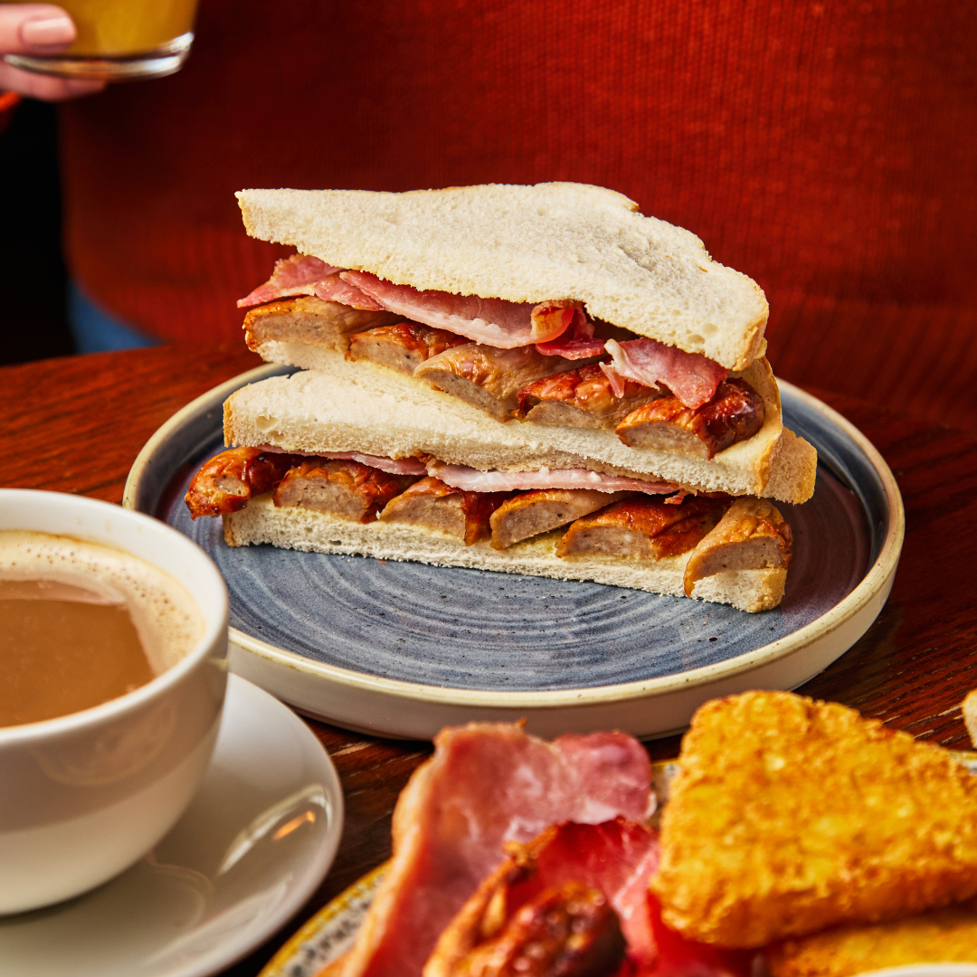 Breakfast sandwich and cup of tea