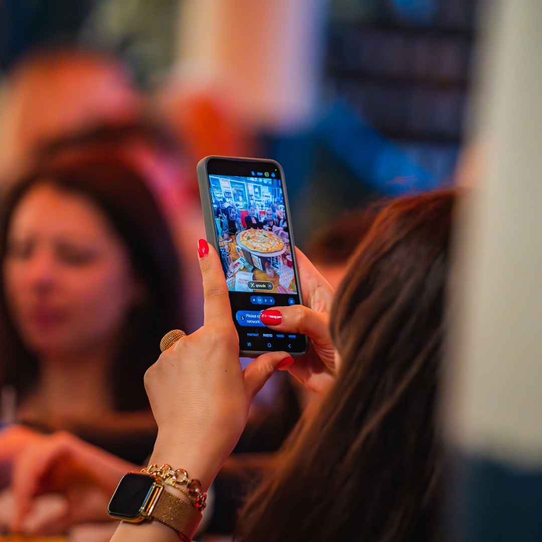 Taking a photo on Rita's 24 inch pizza on mobile