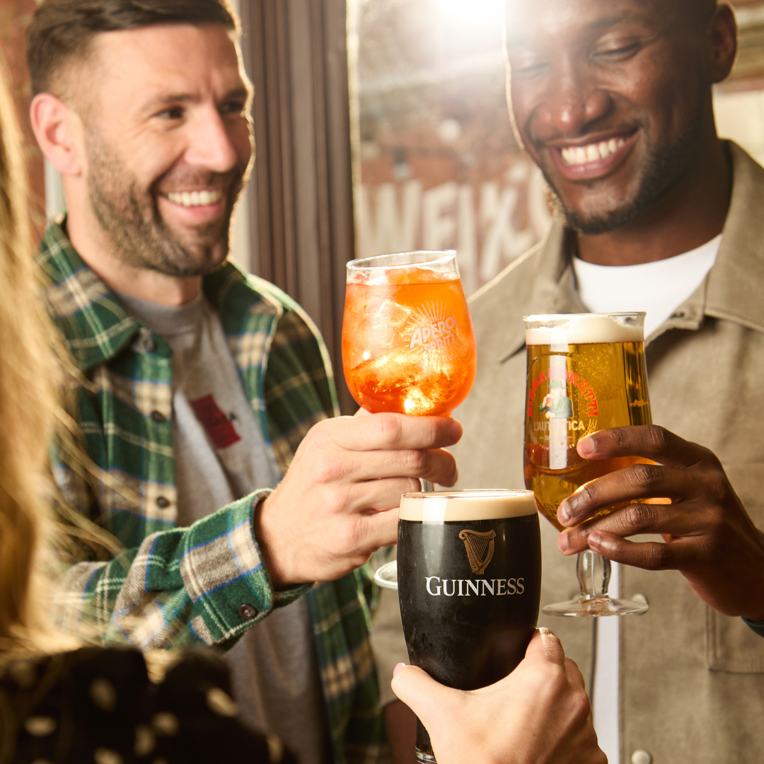 3 PEOPLE CHEERSING DRINKS