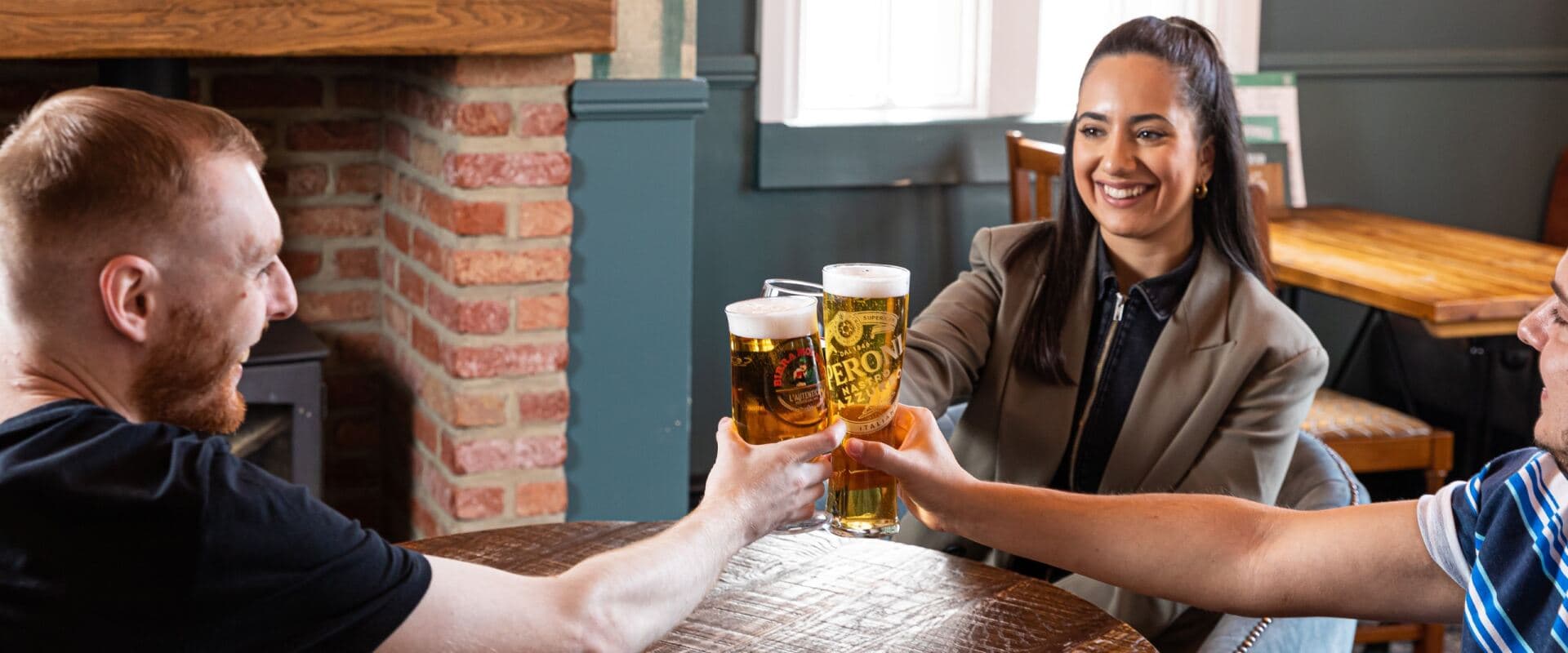 Group Toasting Drinks in a Pub