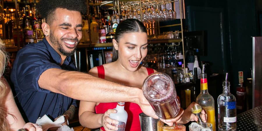 Group of friends taking a cocktail masterclass