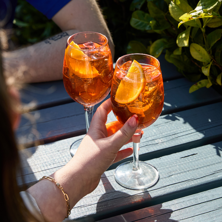 2 aperol spritz in beer garden