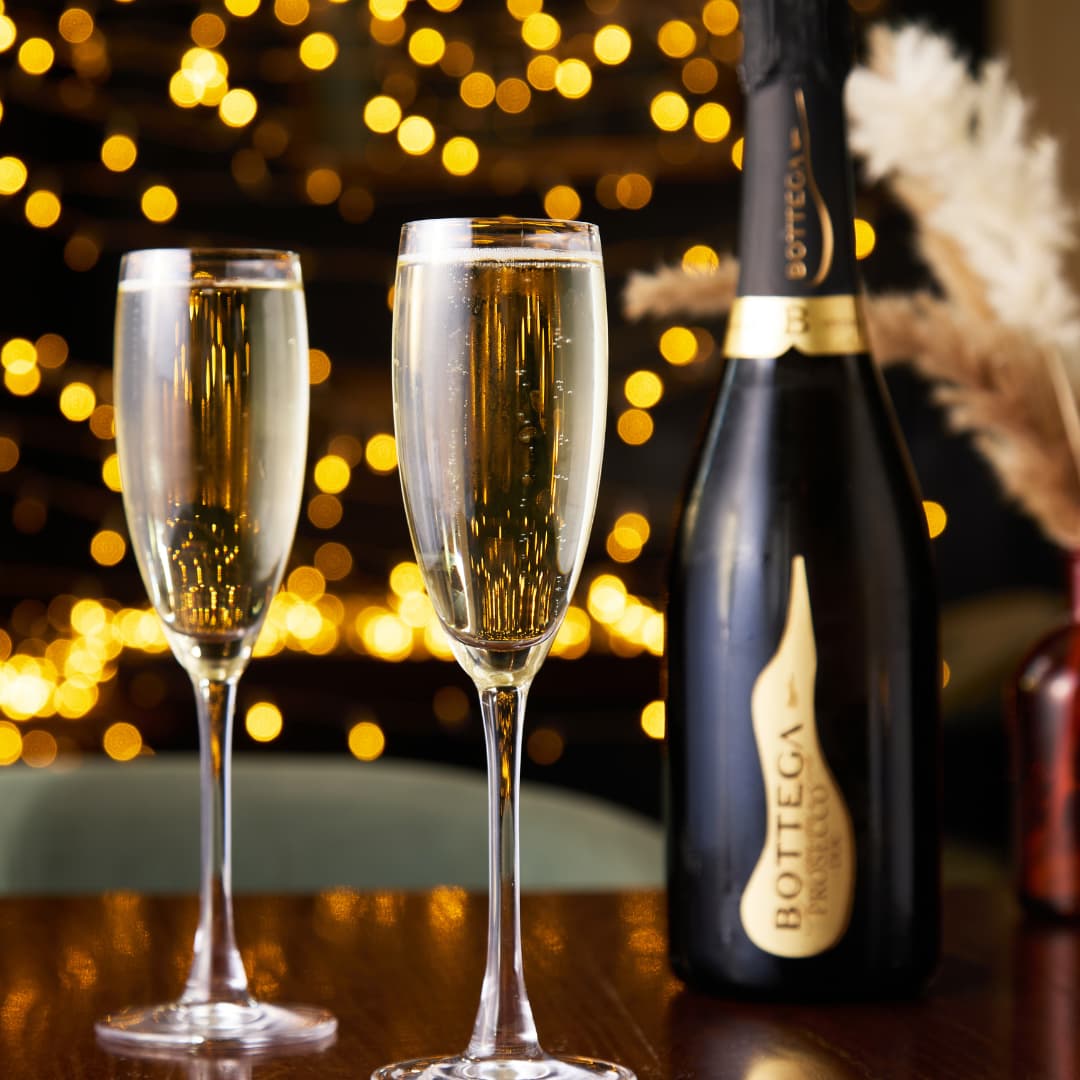 Two Glasses of Prosecco and a Bottle