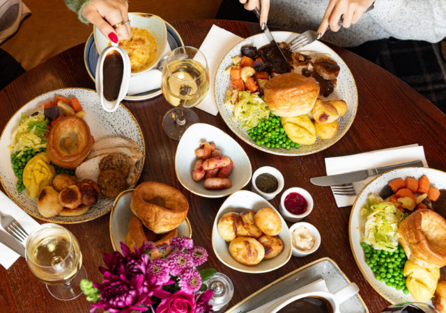 image of a group of people enjoying a sunday roast in a pub