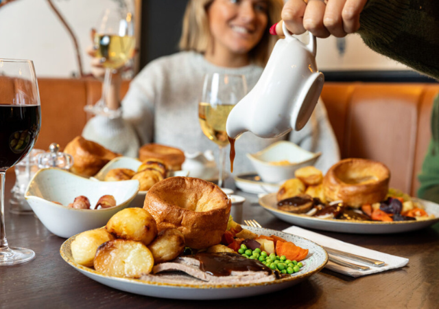image of a group of people enjoying a sunday roast in a pub