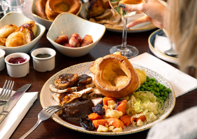 image of a group of people enjoying a sunday roast in a pub